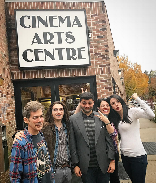 Photo of people posing outside the Cinema Arts Centre entrance